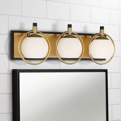 Possini Euro Design Carlyn Mid Century Modern Wall Light Brass Black Hardwire 26" 3-Light Fixture White Glass Globe Shade For Bedroom Bathroom Vanity 1 Possini Euro Design Carlyn Mid Century Modern Wall Light Brass Black Hardwire 26" 3-Light Fixture White Glass Globe Shade For Bedroom Bathroom Vanity
